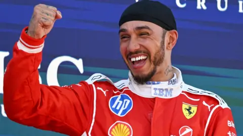Lewis Hamilton clenches his right fist in celebration after winning the Barcelona-Catalunya Grand Prix