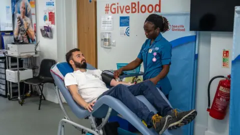 Getty Images A nurse prepares a man for a blood donation on July 29, 2024 at the West End Donor Centre in London, England