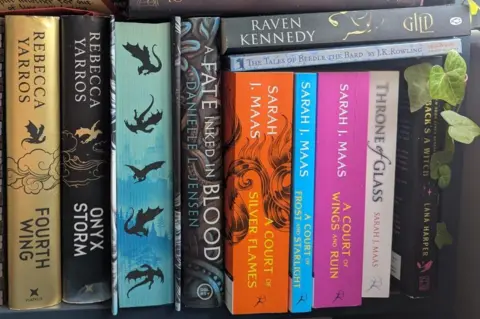 A selection of books from authors including Rebecca Yarros , Sarah J. Maas, Danielle L. Jensen and Raven Kennedy