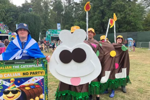 Looking at the Calian the Caterpillar "cake" in the Garden Stage arena.