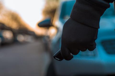 A hand holding a keyless car entry system
