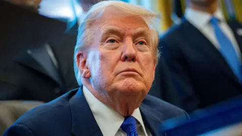 EPA President Donald Trump seen wearing a blue tie during an event in the Oval Office at the White House in Washington, DC, 02 February 2026. 