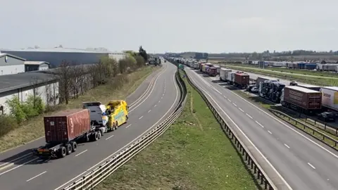 The overturned lorry has been towed 