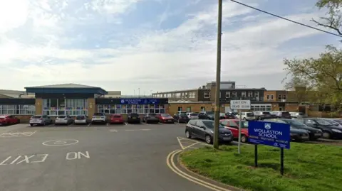 Google Entrance to a 1950s school with car park in front