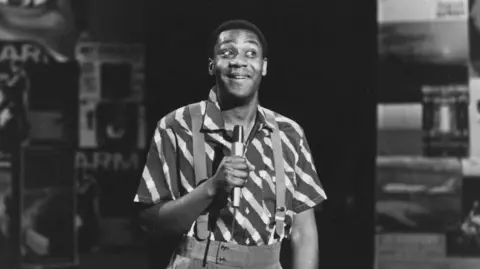Radio Times Black and white photograph of Lenny Henry in a sketch from "The Lenny Henry Show" in 1984