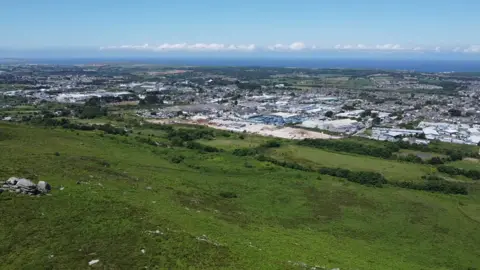 An aerial photo showing Camborne and beyond to the coast