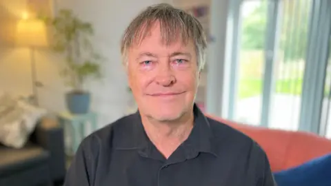 BBC Mr Redfern is wearing a dark shirt