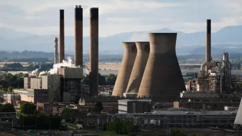 PA Media The chimneys and towers at the Grangemouth plant