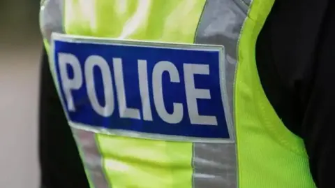 Yellow hi-vis police jacket