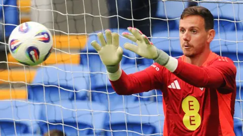 Wales' Danny Ward prepares to catch an approaching ball