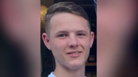 A man smiling at the camera