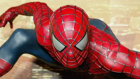 Getty Images A waxwork version Spider-Man in a crouching pose in his red and blue costume