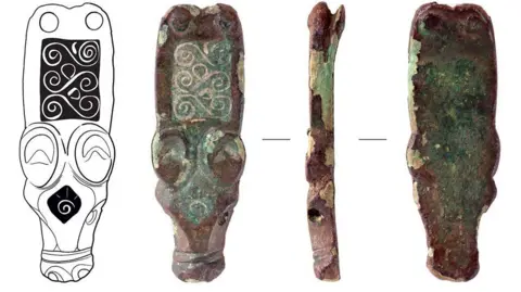 Four views of a Saxon strap end. The first is a line drawing of its front, which shows a stylised animal head with a long snout and big eyes with S-shaped scrolls decorating its back, and the next three are photographs of the object from the front, side and back. It is made from copper alloy, parts of which have gone green and others are a rusty brown.