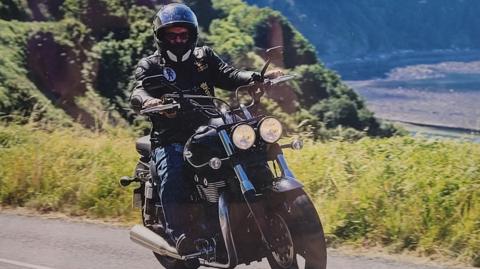 Tim North riding a motorbike