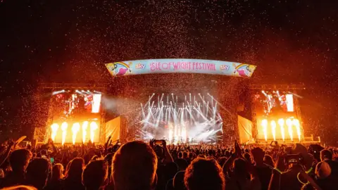 PA Confetti falls and jets of fire spout during the climax of the Stereophonics set as thousands look on.