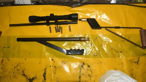 South Wales Police An air rifle on yellow tarpaulin