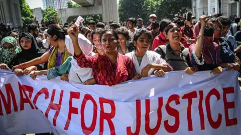 Getty Images People shout slogans during a protest march outside the High Court building demanding justice for the victims arrested and killed in the recent countrywide violence in Dhaka on July 31, 2024
