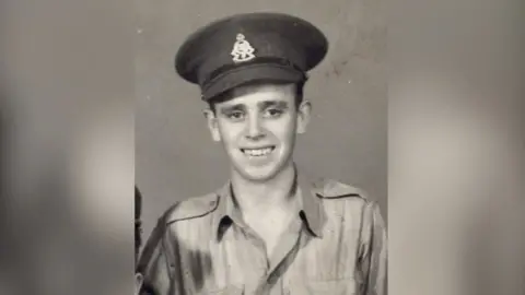 A young man in a British World War Two uniform