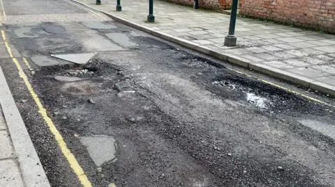 Mike Stevenson A view of bad potholes after a speed hump in Southwell