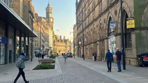 LDRS A city centre traffic-free street with large Victorian-style buildings