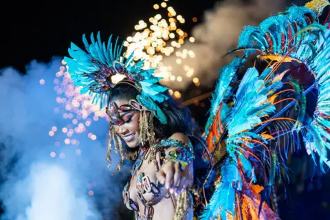 With the permission of Lizbliz Entertainment, a woman wearing a detailed costume in the Trinidad carnival