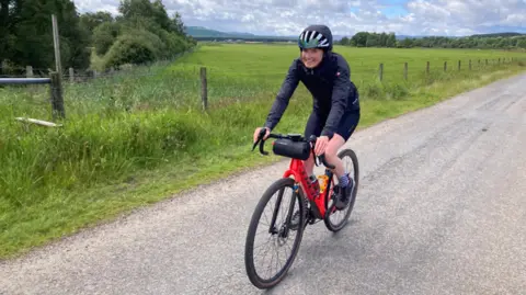 Aviemore resident Sally Devlin pictured riding her bike