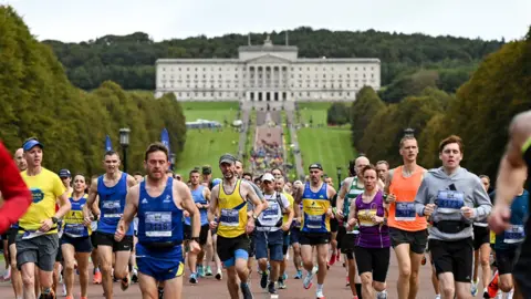 Thousands pf runners run down Stormont mile as part of the Belfast City Marathon.