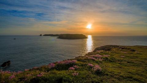 Sunset over Skomer Island in Pembrokeshire taken while walking at Wooltack Point, by Nick Dallimore from Cardiff.