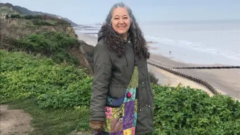 Diane Devereux Diane Devereux by a seaside cliff