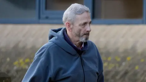 PA Media Edward Brandt, bearded and wearing a blue hoodie, arrives at Southampton Crown Court
