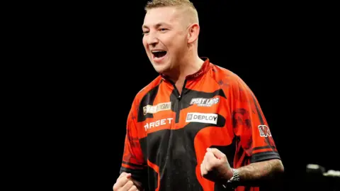 Nathan Aspinall celebrates in Aberdeen