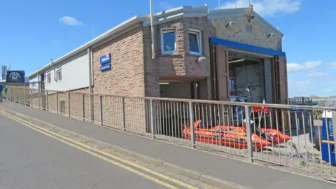 Ian Clayton The outside of the Seahouses boathouse with the inshore rescue boat parked outside 