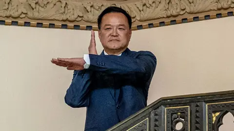 Thai Prime Minister Anutin Charnvirakul poses as he arrives at the Government House in Bangkok on February 9, 2026