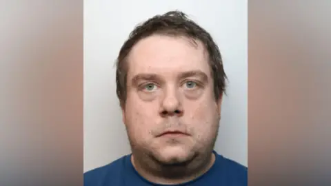 Mugshot of Christopher Saunders-Pope.