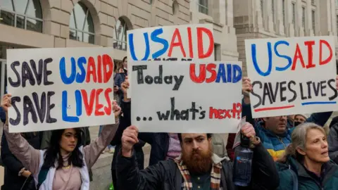 Demonstrators outside the US Agency for International Development (USAID) headquarters in Washington, DC on Monday 3 Feb 2025