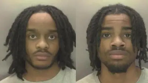 West Midlands Police Da Silva and Fabio Bandarrinha - two custody images od two men with black beards and mustaches. They both hair shoulder length hair, the man on the left's hair is loc'd and the man on the right's hair is twisted