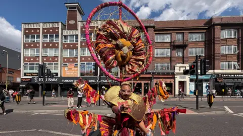 A person wearing an elaborate costume