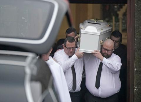 James Healy carries his son's coffin from the Church of the Immaculate Conception