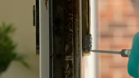 A door having a substance squeezed onto it using a forensic tool 