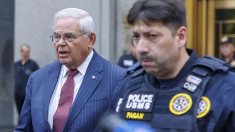 Bob Menendez is seen walking outside the courthouse after his conviction 