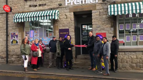 People outside Post Office for ribbon cutting ceremony