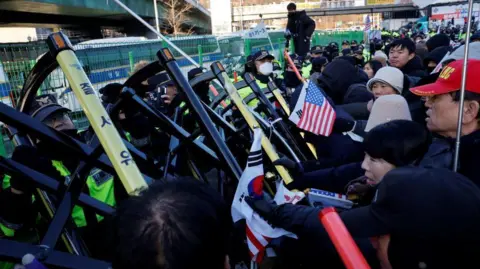 Reuters Supporters of Yoon Suk Yeol scuffled with police officers as officers sought to execute an arrest warrant on Wednesday morning.