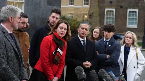 PA Media The families of Ian, Barnaby and Grace outside number 10 Downing Street as the Nottingham Inquiry was announced