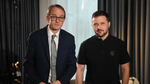 Chris Mason and Volodymyr Zelensky standing together looking at the camera