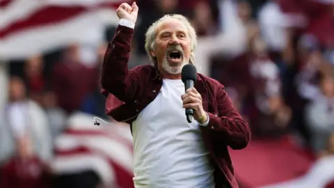 SNS Colin Chisholm sings at Tynecastle