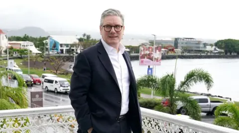 PA Media Prime Minister Sir Keir Starmer on the balcony in Samoa