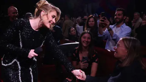 Getty Images Adele performs in the audience during "Weekends with Adele" at The Colosseum at Caesars Palace on January 26, 2024 in Las Vegas, Nevada.
