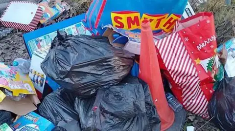 A pile of rubbish that was dumped by a rouge trader in Kirby in Ashfield is pictured. It includes bags, a traffic cone and cardboard boxes