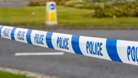 Getty Images Police marker tape for cordoning crime scene.
