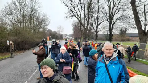 Jonathan Hornett Protesters by trees being cut down in Wellingborough